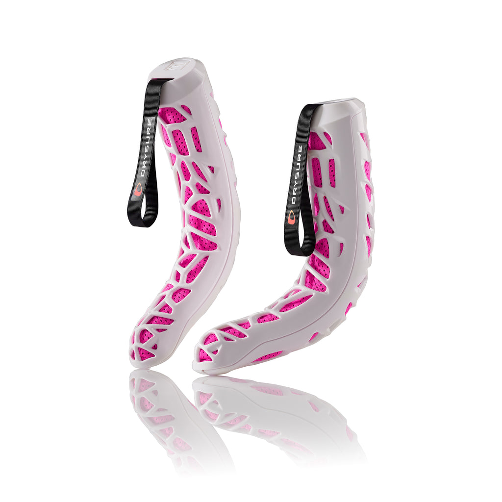 Pink and White Drysure Extreme boot dryers on a white background.
